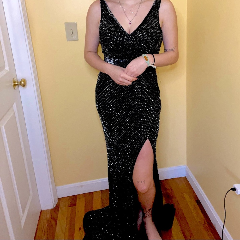 Long Black sequin dress with slit and low back.